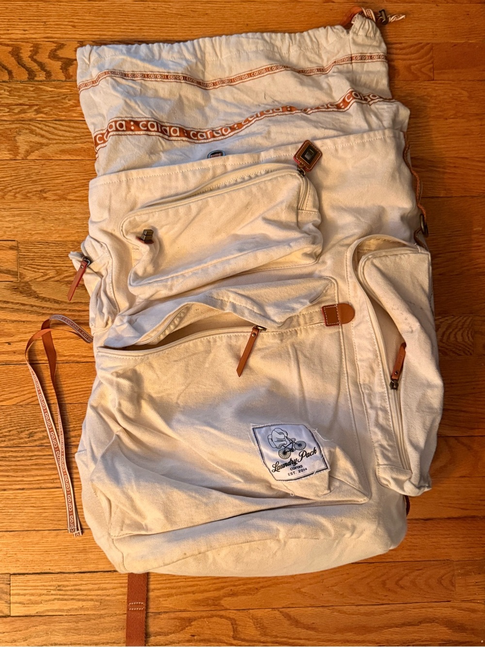 caraa Cream Canvas Backpack with Brown Trim and Red Accents